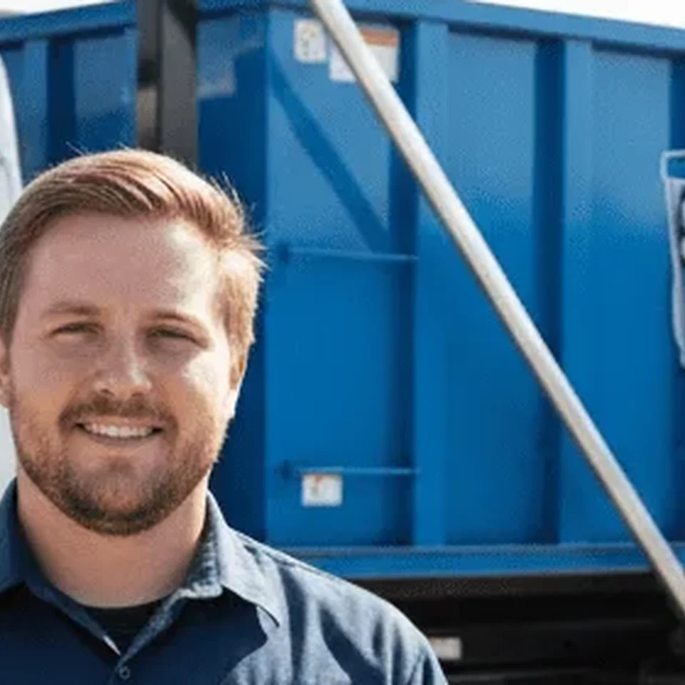 Anthony Russo, Lead Driver at Steele Bros Dumpster Rental Pittsburgh, in front of a company truck
